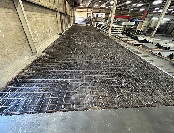 Newly poured concrete commercial parking lot in Houston, TX with reinforced slab