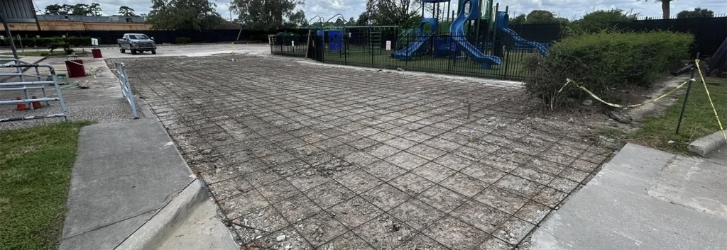 Parking lot installation showing steel reinforcement and joint layout