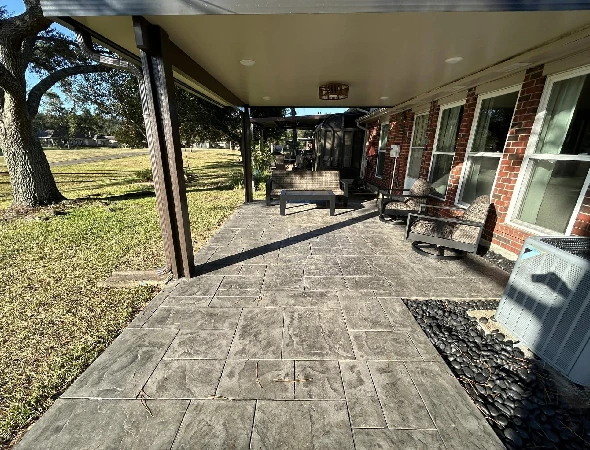 Finished covered patio providing shade over an outdoor seating area