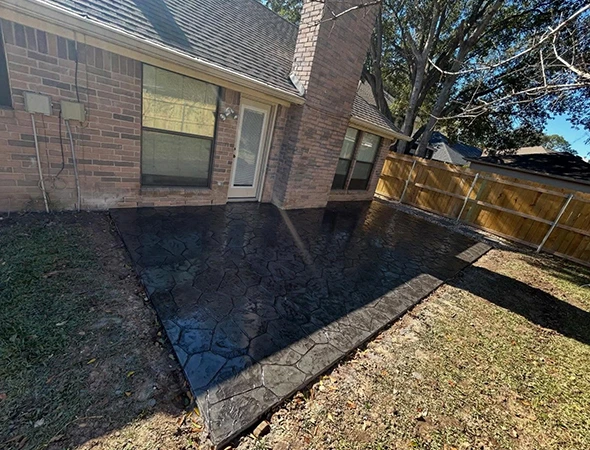 Covered patio construction showing roof framing and support posts