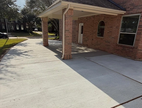 Finished covered patio providing shade over an outdoor seating area